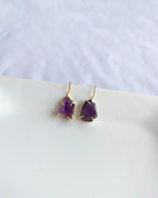 Raw purple amethyst earrings with gold-tone hook settings