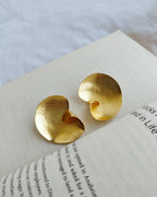 Sculptural gold swirl statement earrings