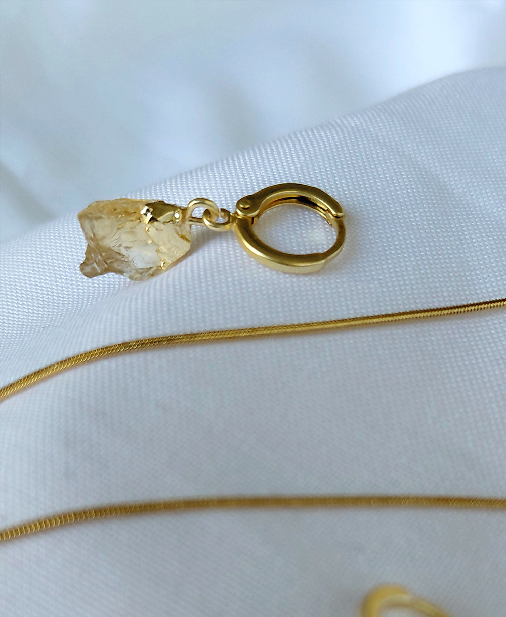 Solara Gemstone Jewellery Set with raw citrine pendant necklace, matching hoop drop earrings and 18K gold-plated snake chain.