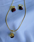 Crimson Muse Garnet Jewellery Set with raw garnet pendant necklace, matching hoop drop earrings and 18K gold-plated snake chain.