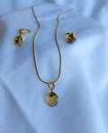 Solara Gemstone Jewellery Set with raw citrine pendant necklace, matching hoop drop earrings and 18K gold-plated snake chain.