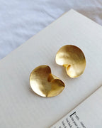 Sculptural gold swirl statement earrings