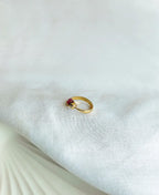 Amethyst Tiny Gem Ring with natural raw purple gemstone and 18K gold-plated adjustable band.