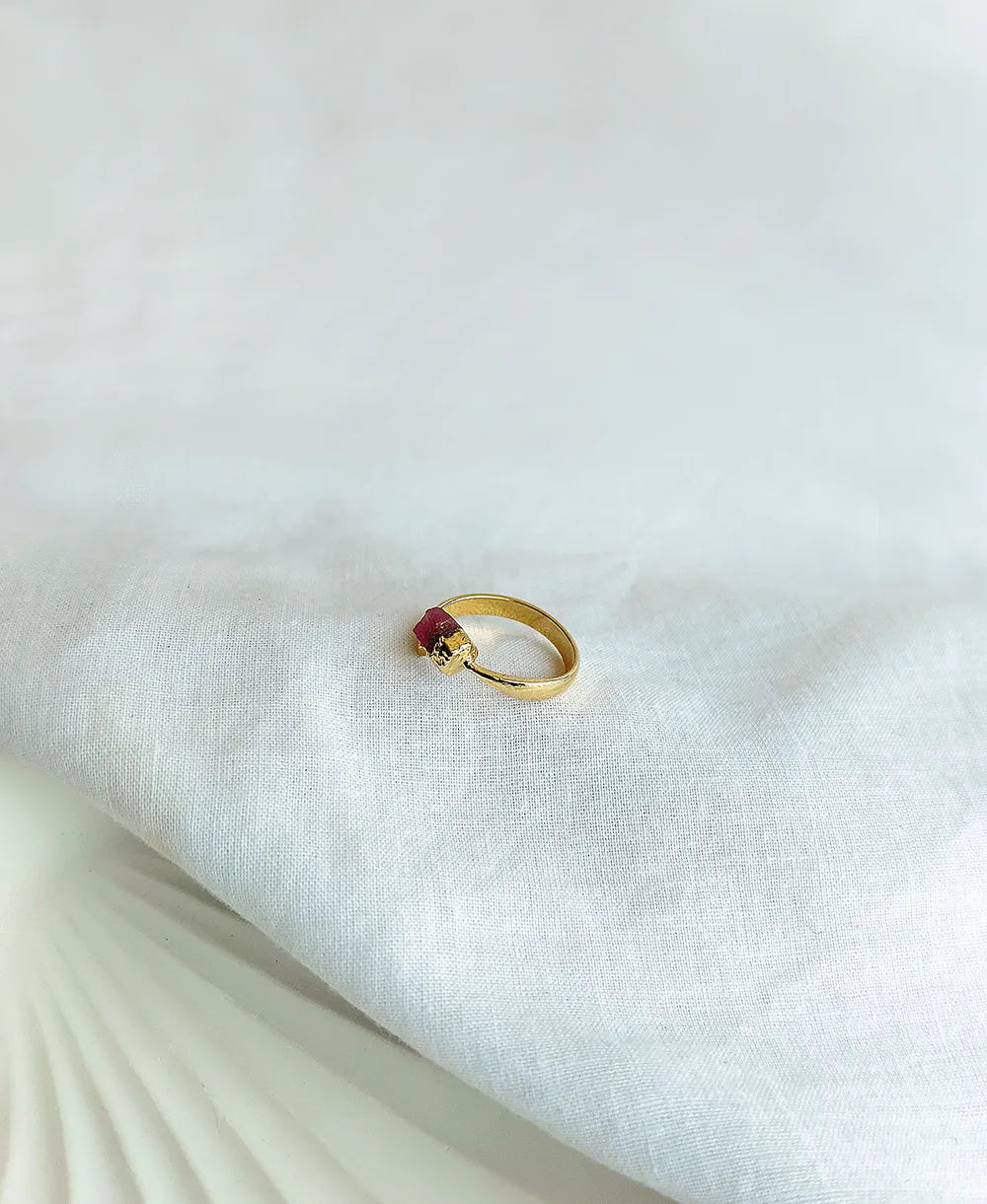 Amethyst Tiny Gem Ring with natural raw purple gemstone and 18K gold-plated adjustable band.