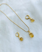 Golden Drip Citrine Jewellery Set with natural yellow citrine pendant necklace and matching 18K gold-plated drop earrings.