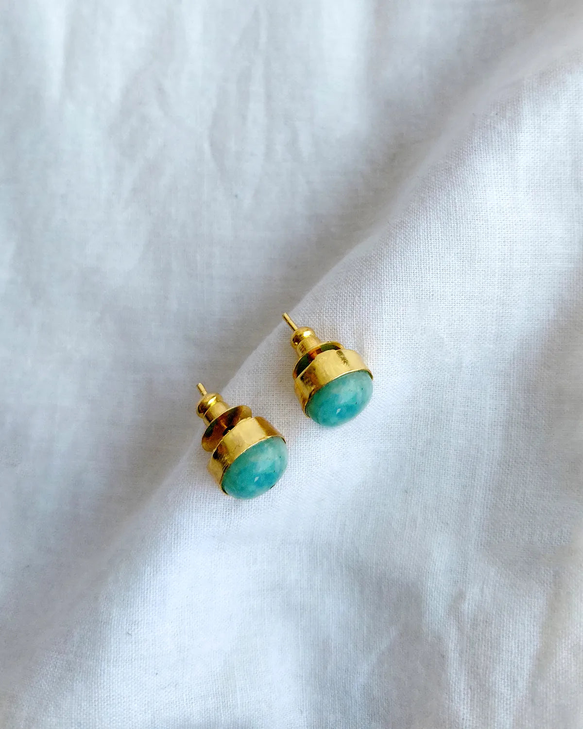 Turquoise blue round gold stud earrings by Solmist Muse – view 3
