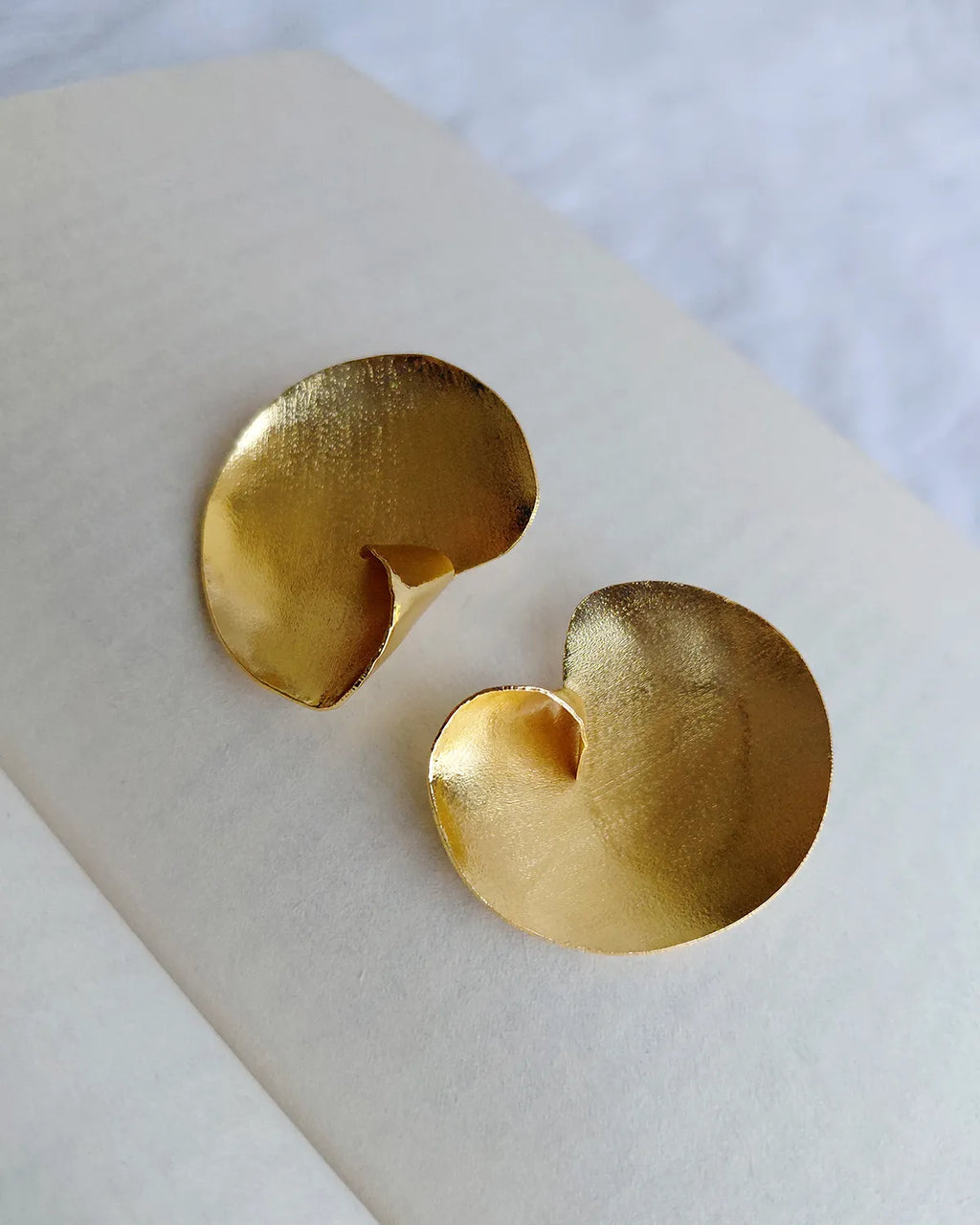 Sculptural gold swirl statement earrings