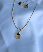 Solara Gemstone Jewellery Set with raw citrine pendant necklace, matching hoop drop earrings and 18K gold-plated snake chain.