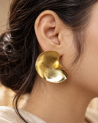 Sculptural gold swirl statement earrings