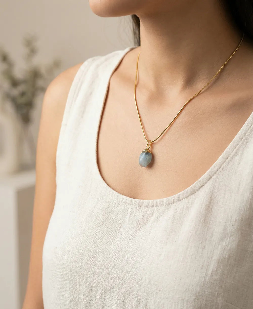 Sea Glass Aquamarine 18K Gold Plated Necklace with natural raw blue gemstone and gold-capped pendant on snake chain.