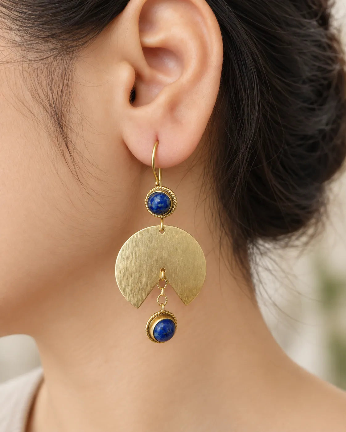 Lapis Lazuli gold fan earring worn on model