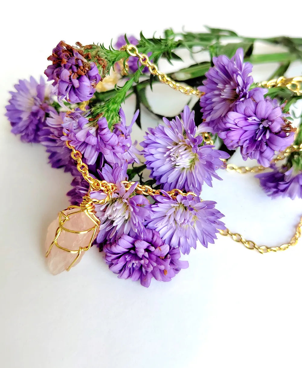 Rosewater Crystal Wrap Necklace with natural raw rose quartz crystal and 18K gold-plated wire-wrapped pendant.