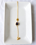 Amethyst star bracelet on white jewelry tray