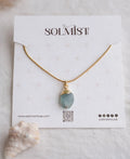 Sea Glass Aquamarine 18K Gold Plated Necklace with natural raw blue gemstone and gold-capped pendant on snake chain.