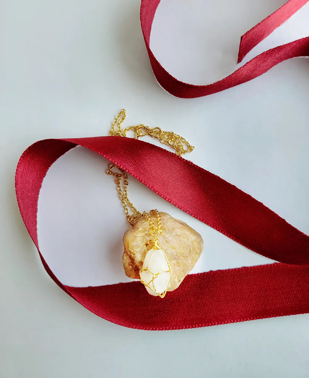 Shellbound Moonstone Pendant with natural raw moonstone crystal and 18K gold-plated wire-wrapped design.