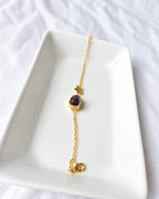 Amethyst star bracelet angled view on white jewelry tray