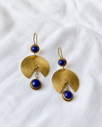 Lapis Lazuli gold fan earrings on white fabric