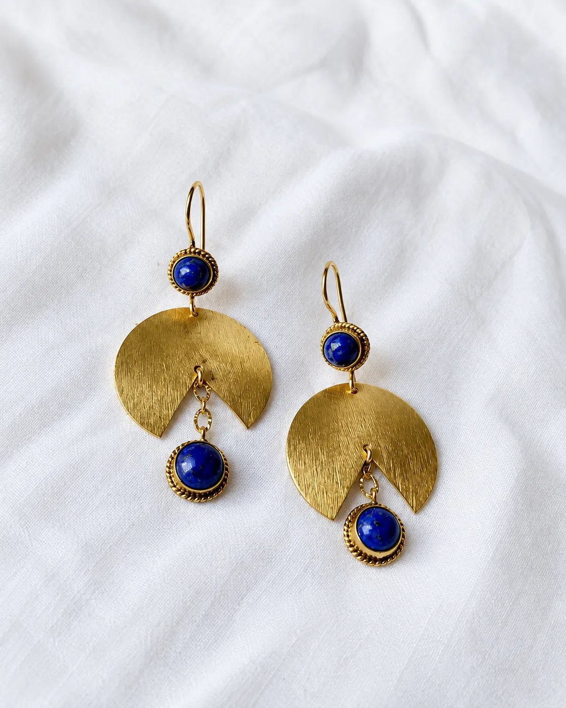 Lapis Lazuli gold fan earrings on white fabric