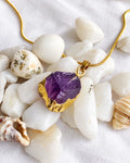 Raw amethyst gold pendant necklace close-up
