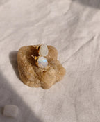 Moon Pebble Moonstone Stud Earrings with raw milky moonstone gemstones and 18K gold-plated bezel setting.