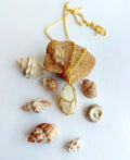 Shellbound Moonstone Pendant with natural raw moonstone crystal and 18K gold-plated wire-wrapped design.