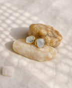 Moon Pebble Moonstone Stud Earrings with raw milky moonstone gemstones and 18K gold-plated bezel setting.