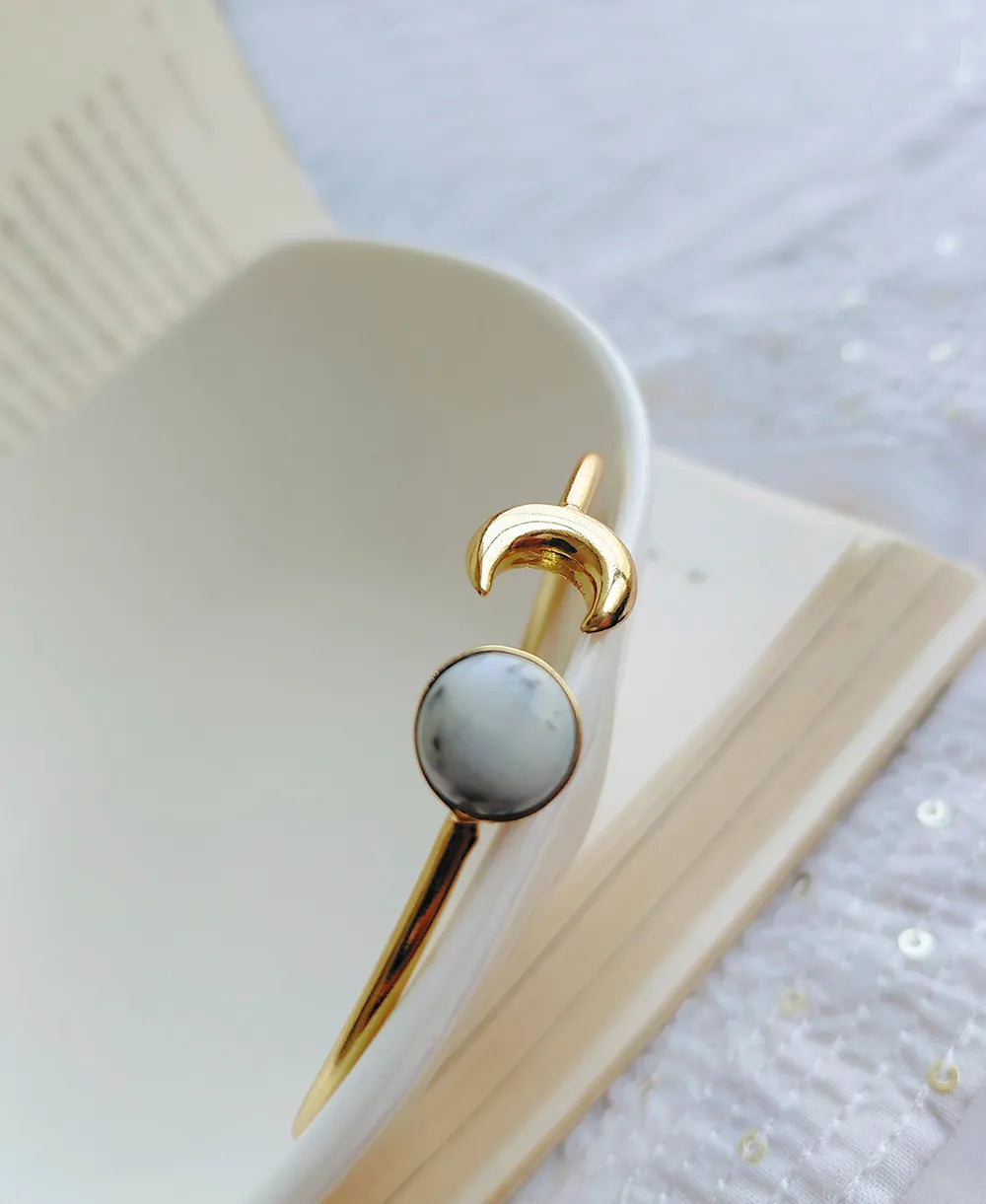 Natural White Howlite moon ring in an elegant gold finish