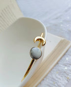 Natural White Howlite moon ring in an elegant gold finish