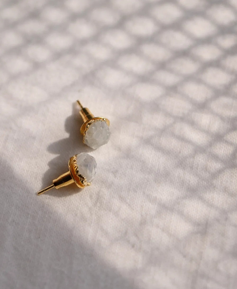 Moon Pebble Moonstone Stud Earrings with raw milky moonstone gemstones and 18K gold-plated bezel setting.