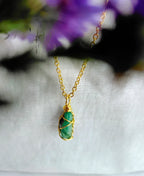 Verdant Loop Emerald 18K Gold Plated Necklace with natural green gemstone and gold wire-wrapped pendant.