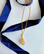 Honey Gold Citrine Wrap Necklace with natural raw citrine crystal and 18K gold-plated wire-wrapped pendant.