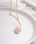 Love Curve Rose Quartz Necklace with natural pink teardrop gemstone and 18K gold-plated curved pendant.