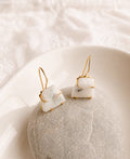 Lunar Mist Moonstone Earrings with natural white moonstone gemstones and 18K gold-plated French hook setting.