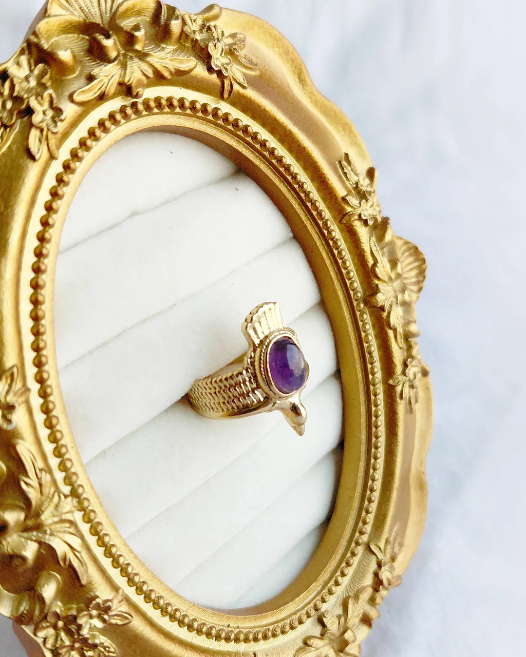 Amethyst gold plated statement ring styled in ornate frame