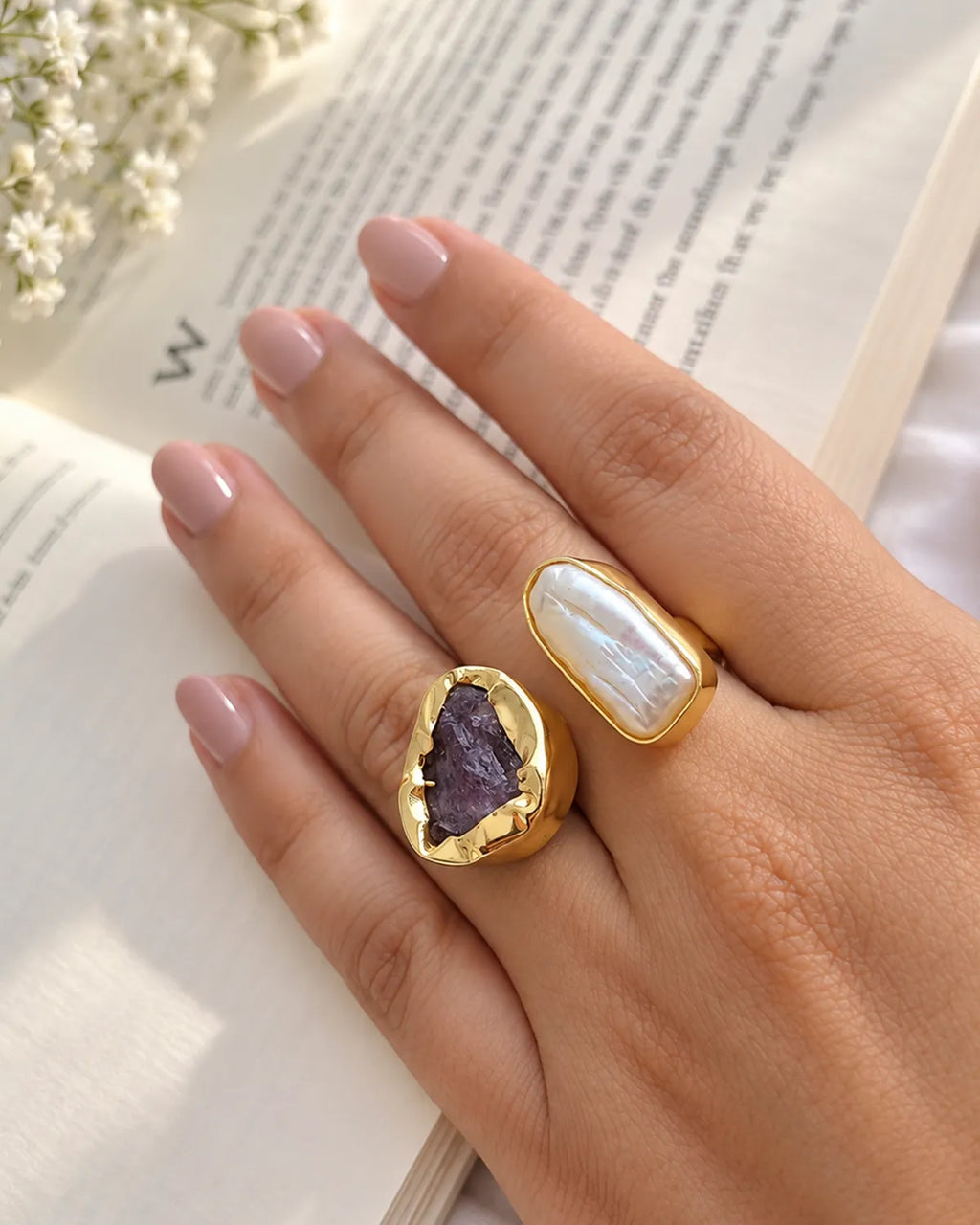 Amethyst and pearl adjustable ring worn on hand