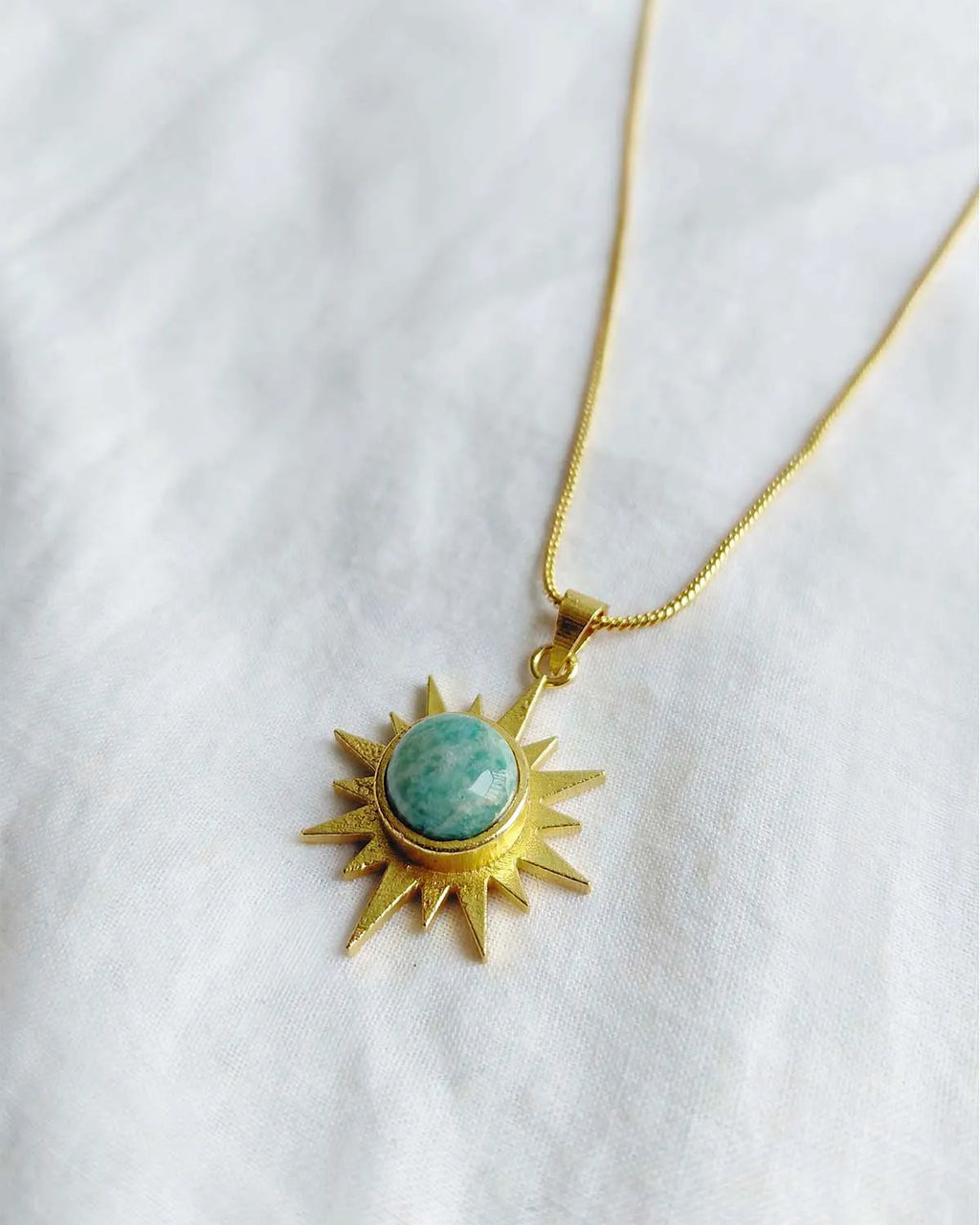 Amazonite Sunburst Muse gold plated necklace flat lay