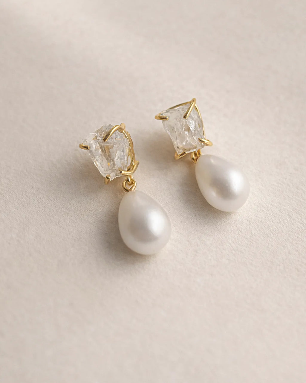 Clear Quartz and pearl drop earrings close-up