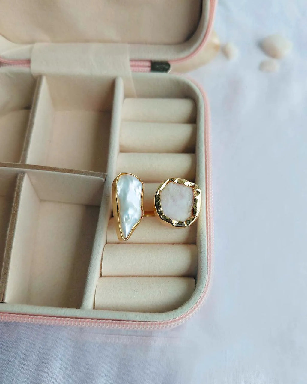 Gold plated dual stone ring displayed in a jewellery case