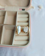 Gold plated dual stone ring displayed in a jewellery case