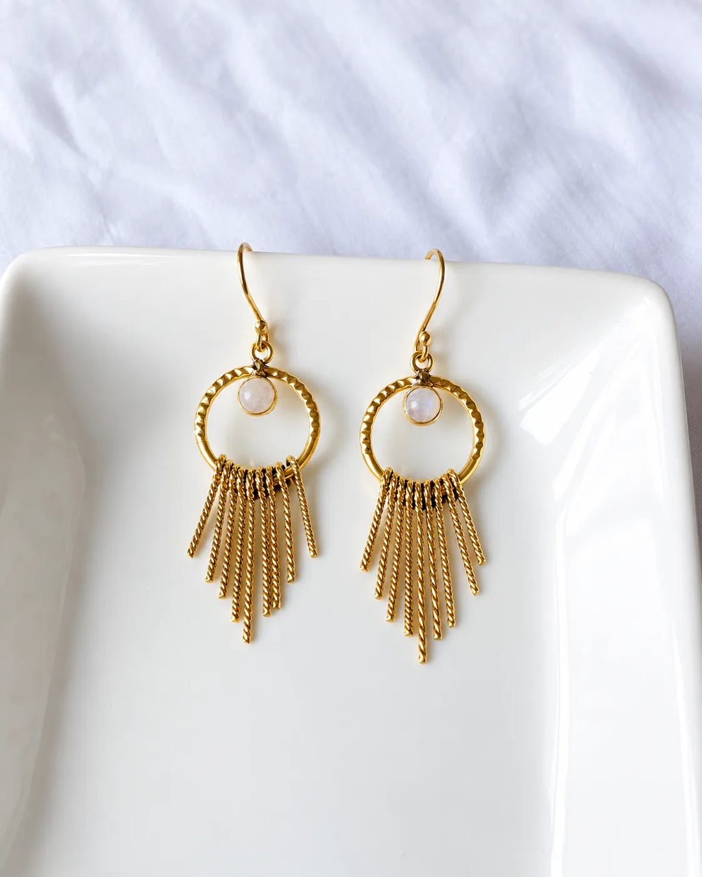 Moonstone gold tassel earrings front view