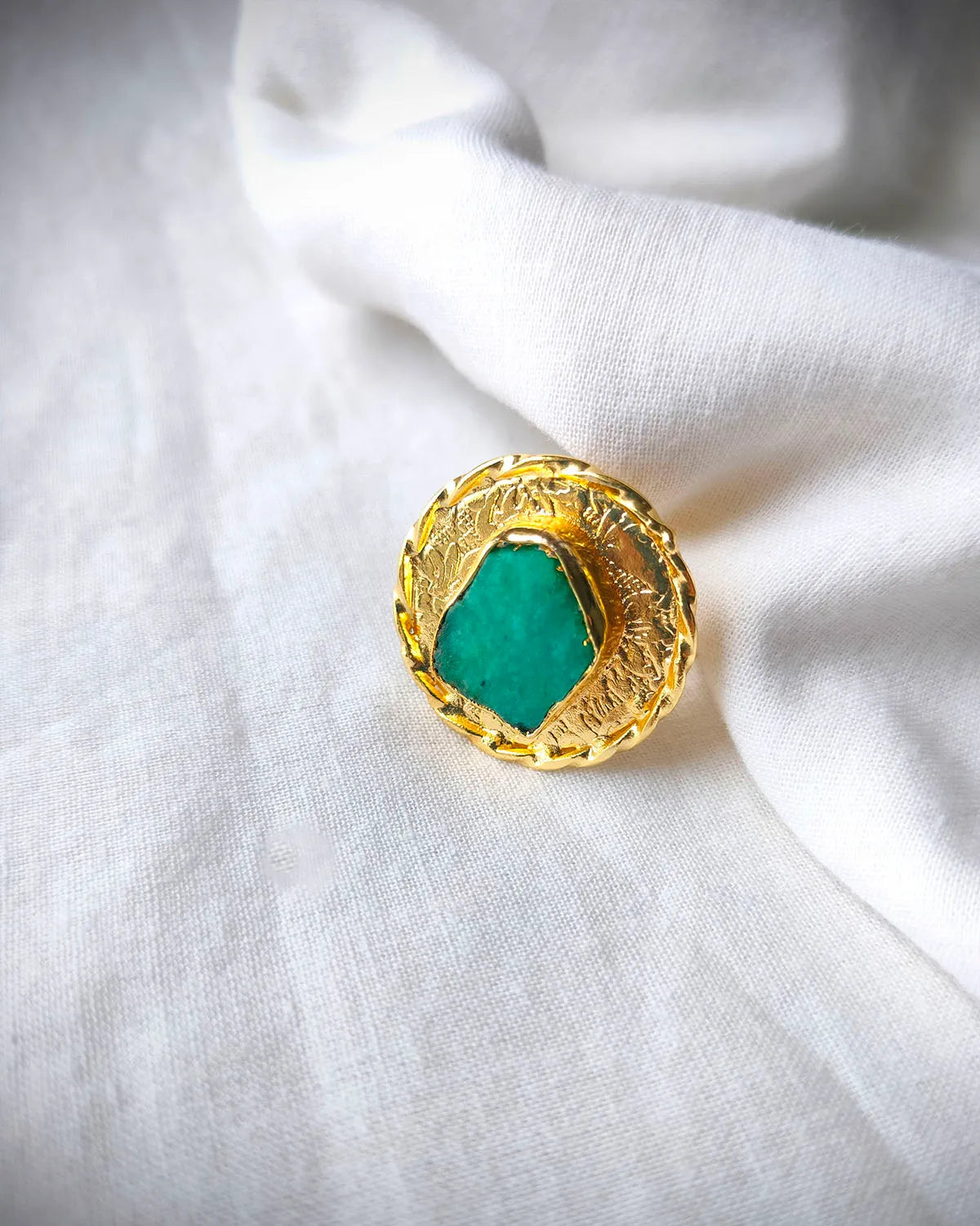 Green aventurine textured gold statement ring close-up