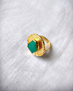 Green aventurine textured gold statement ring angled view