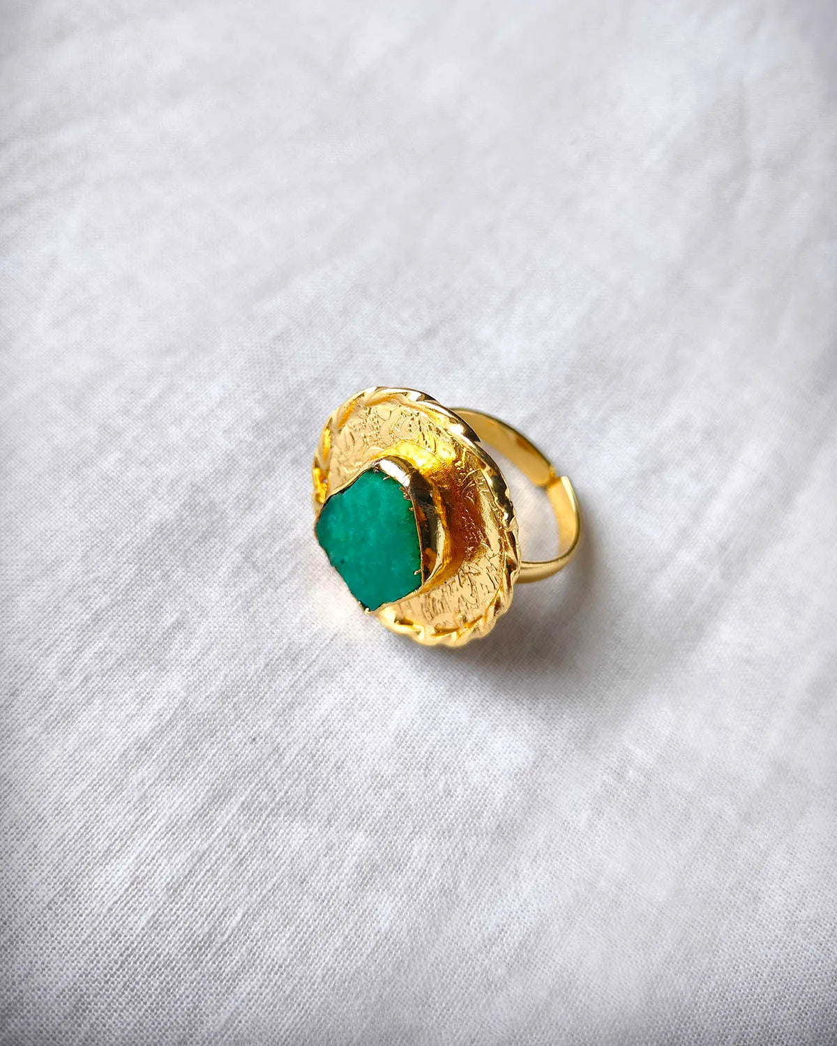 Green aventurine textured gold statement ring angled view