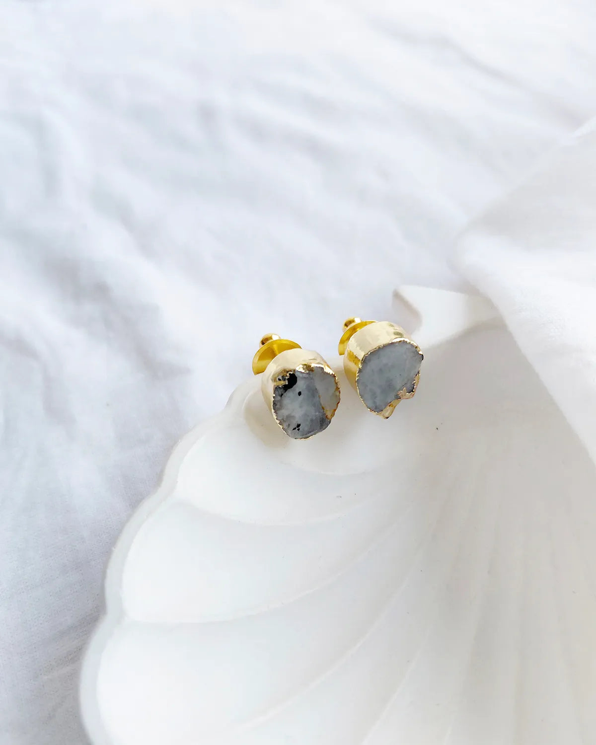 Natural grey stone gold stud earrings front
