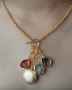 Multistone Gold Charm Necklace worn close-up