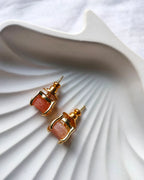 Peach raw stone gold stud earrings side view