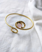 Rose quartz spiral gold cuff bracelet angled view
