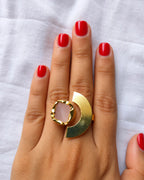 Rose quartz statement ring worn on hand