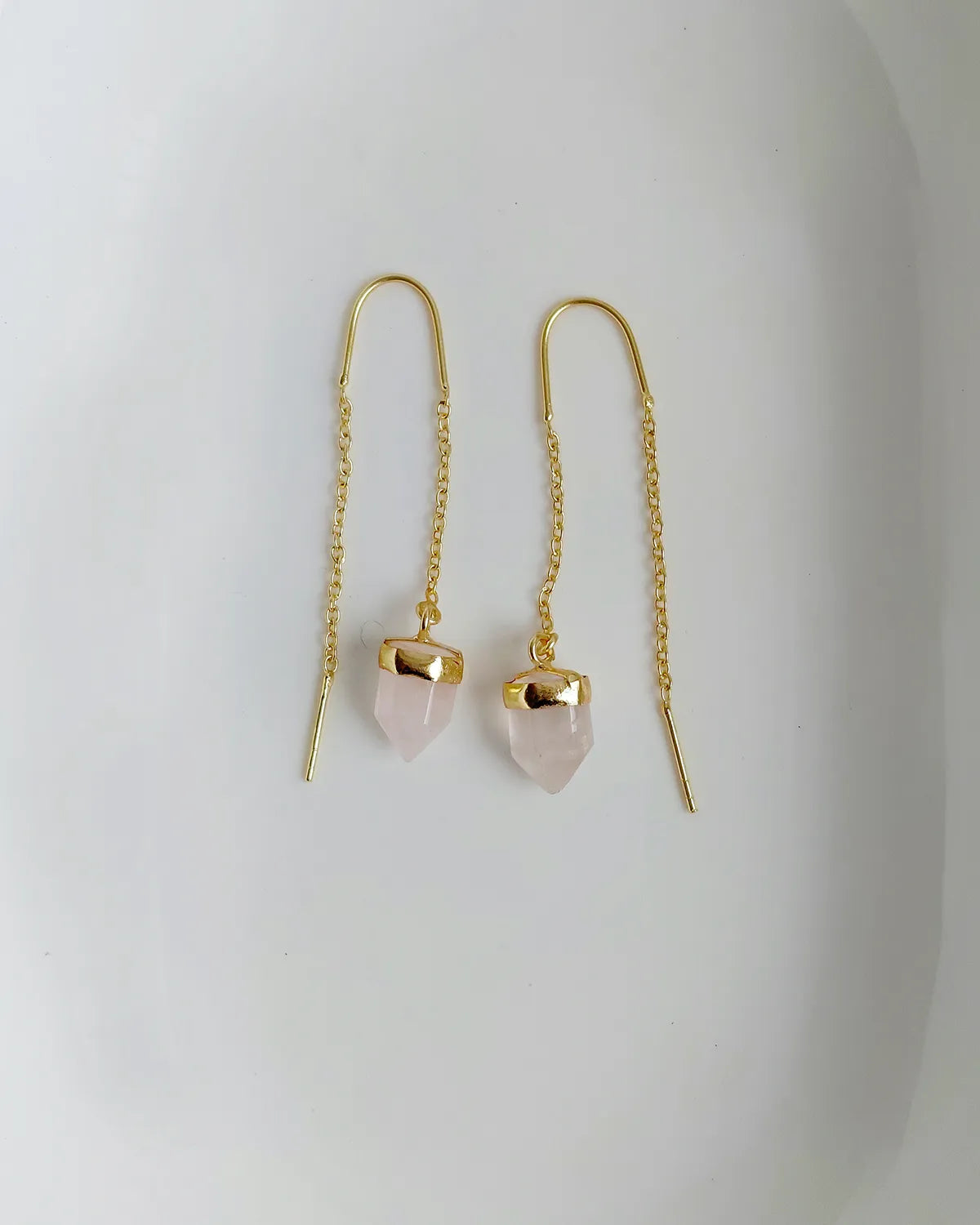Rose Quartz threader earrings pair on white background