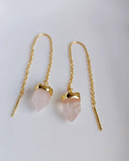 Close-up of natural Rose Quartz threader earrings with gold-plated chain